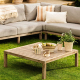 Outdoor Porthallow corner sofa  with a sectional sofa and coffee table on grass