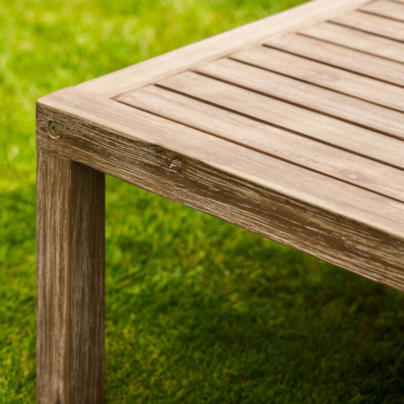 Wooden Porthallow coffee table on a grassy background