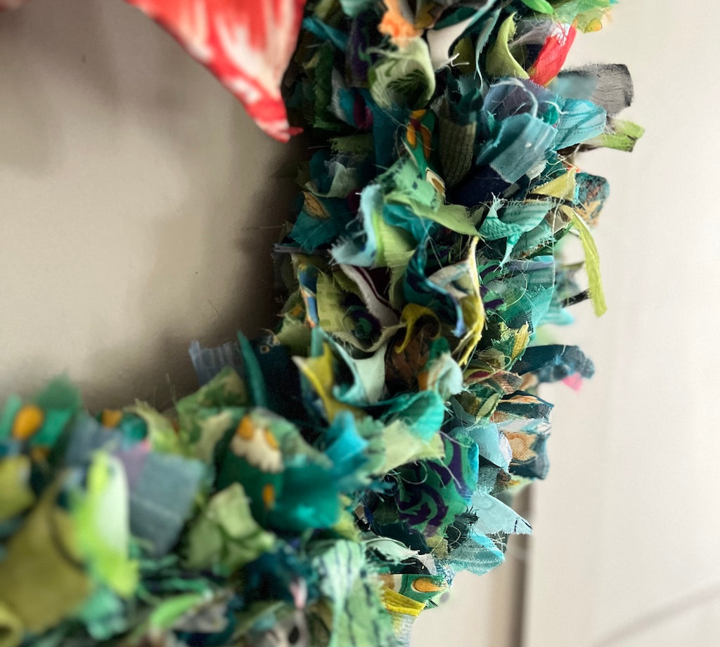 Colorful fabric wreath with a neutral background