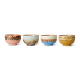 Set of four ceramic bowls with multicolored glaze on a white background