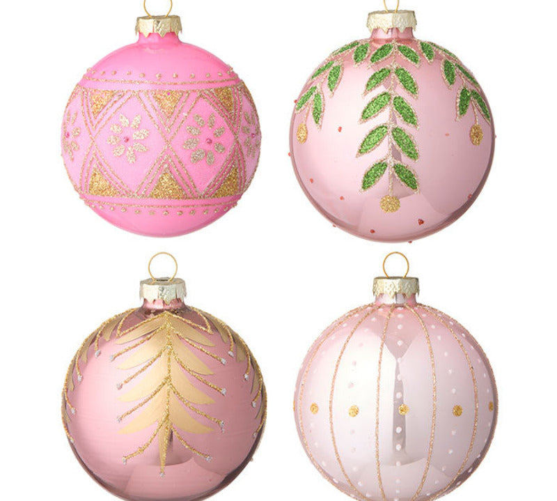Four pink Christmas ornaments with gold and green decorations on a white background