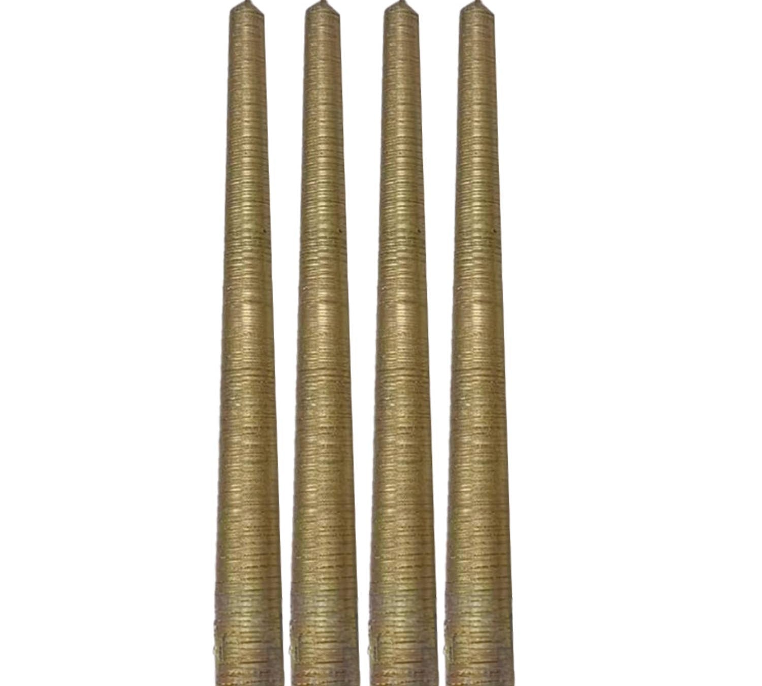 Four gold ribbed candles on a white background