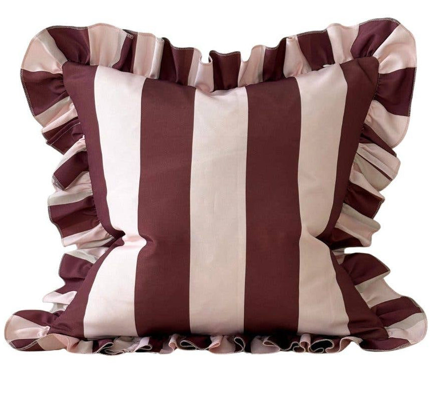 Striped pillow with ruffled edges on a white background
