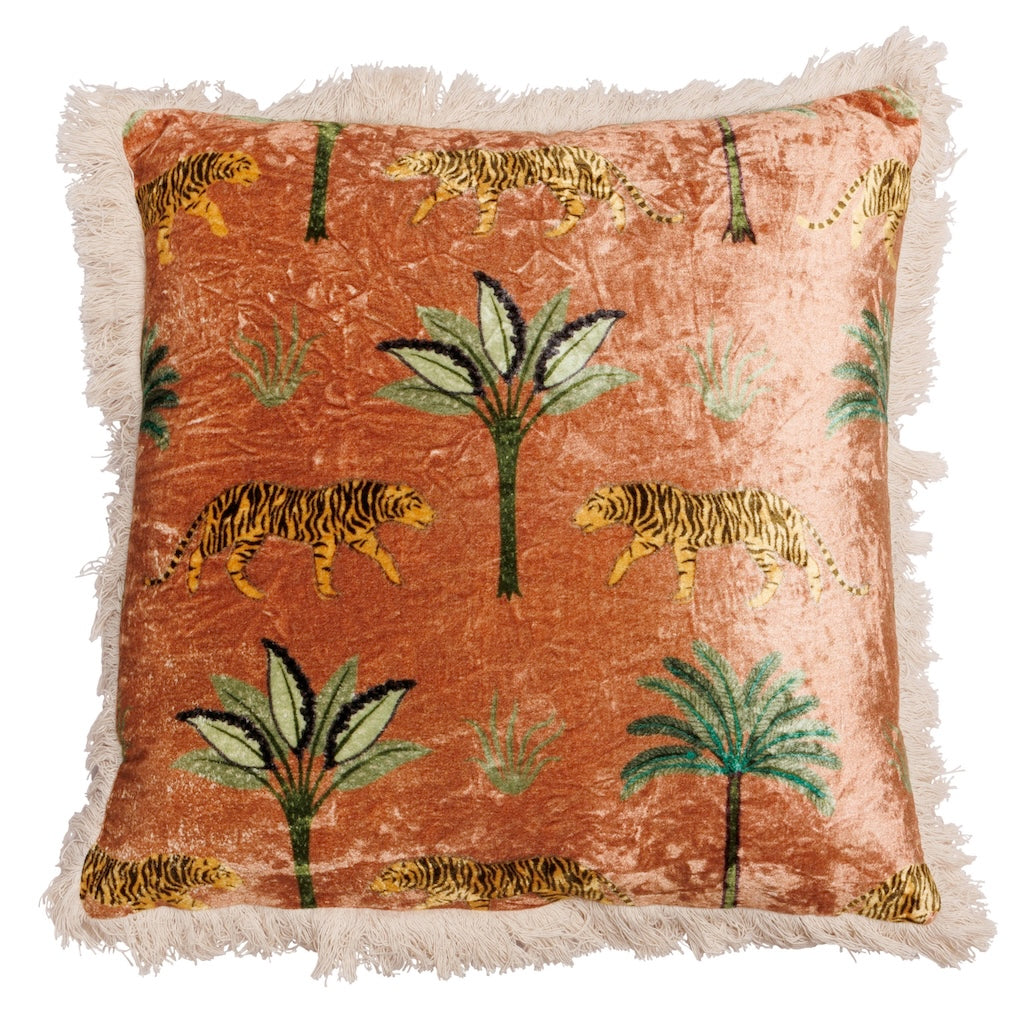 Decorative pillow with tiger and palm tree pattern on a rust-colored background