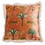 Decorative pillow with tiger and palm tree pattern on a rust-colored background
