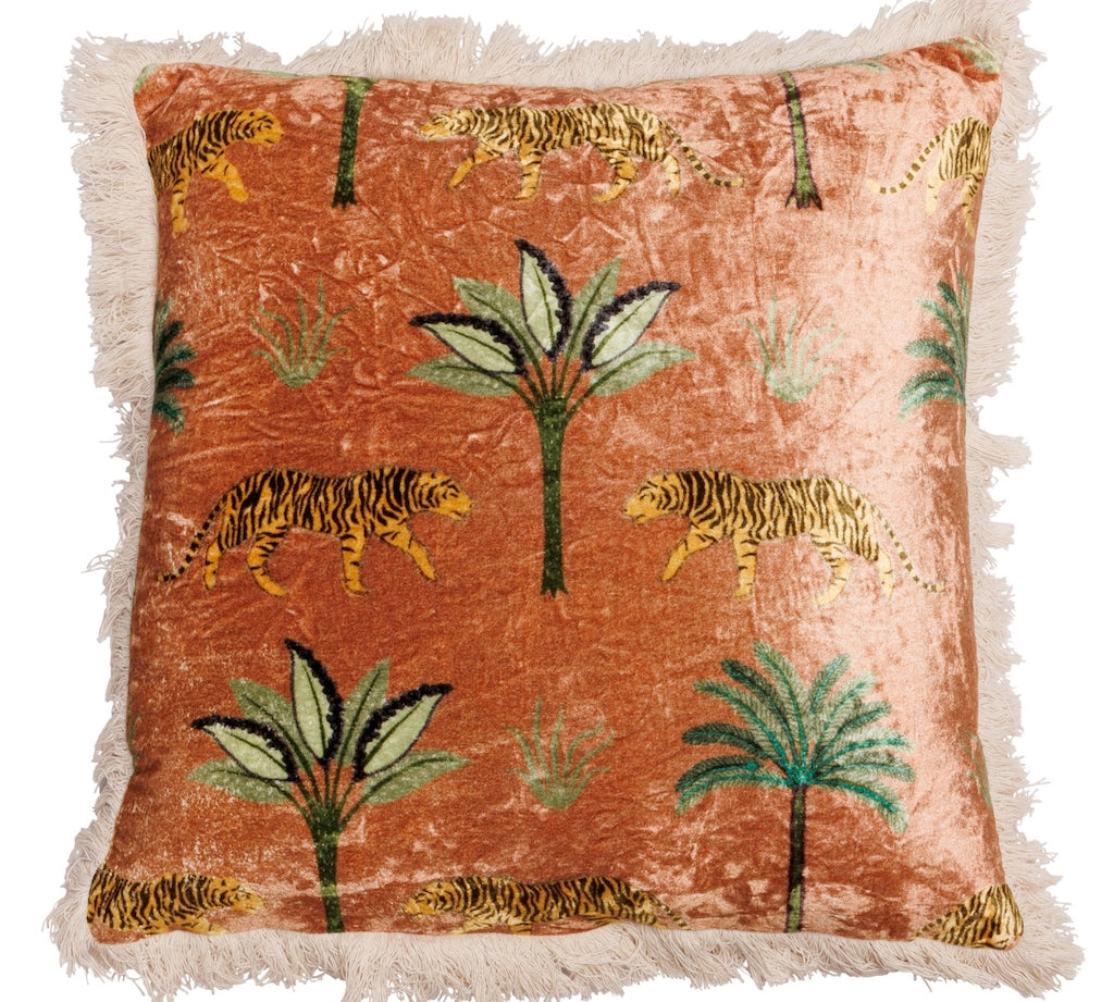 Decorative pillow with tiger and palm tree pattern on a rust-colored background