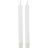 Two white LED candles on a white background