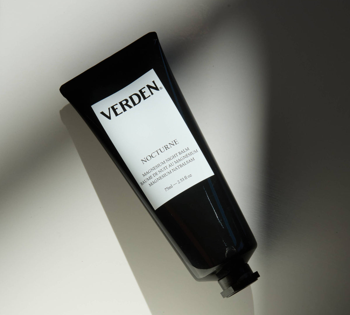 Black tube of Verden Nocturne magnesium skincare product on a light background