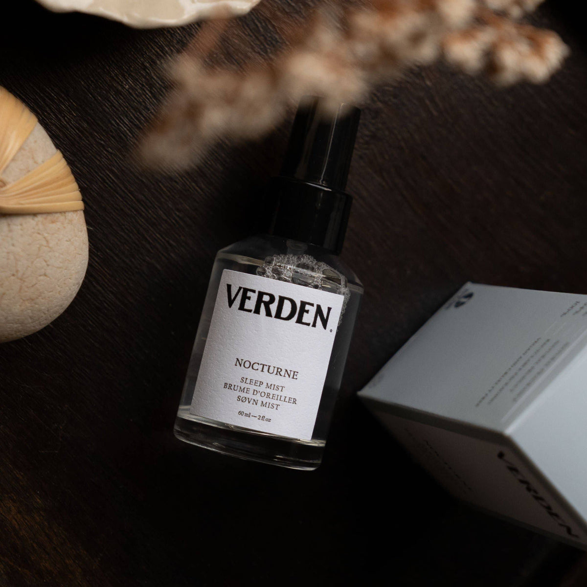 Verden Nocturne sleep mist bottle on a dark surface with decorative elements.