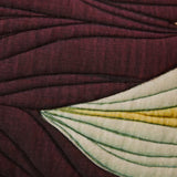 Close-up of textured fabric with a floral pattern