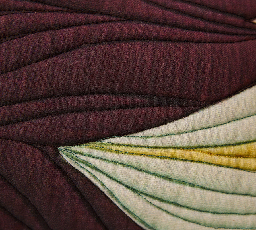 Close-up of textured fabric with a floral pattern