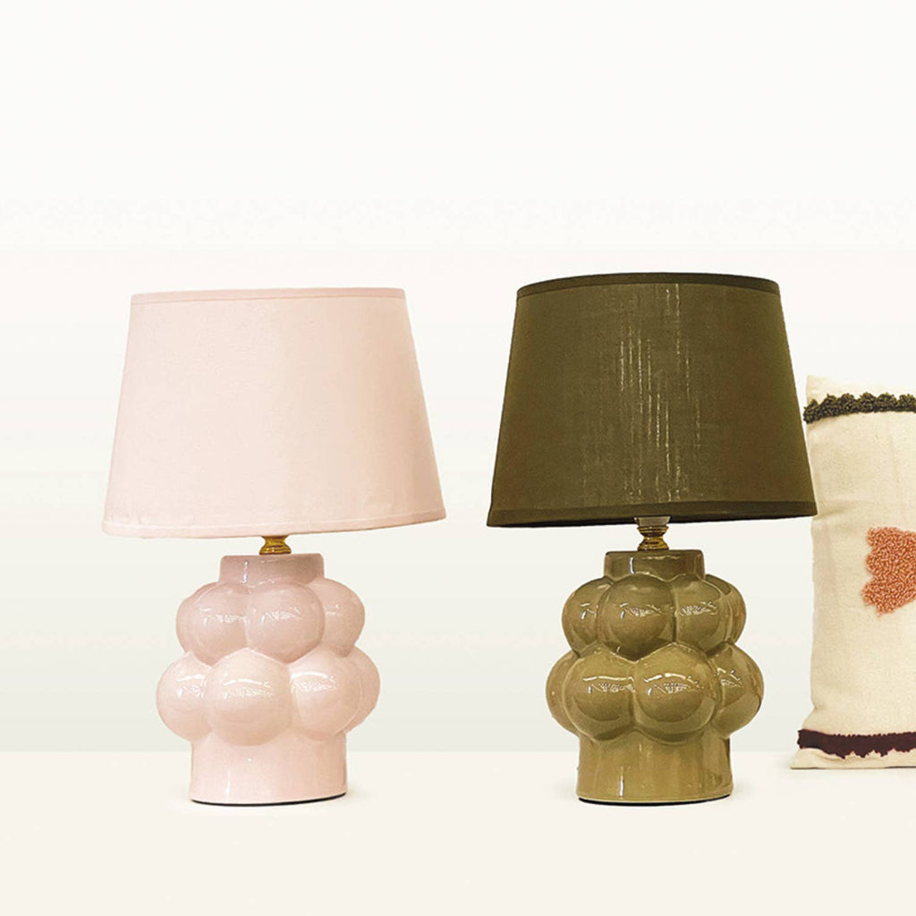 Two ceramic table lamps with different shades on a white background