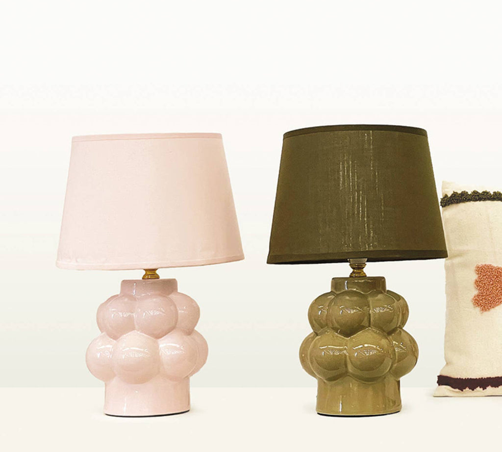 Two ceramic table lamps with different shades on a white background