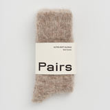 Pair of brown socks with a 'Pairs' label on a white background