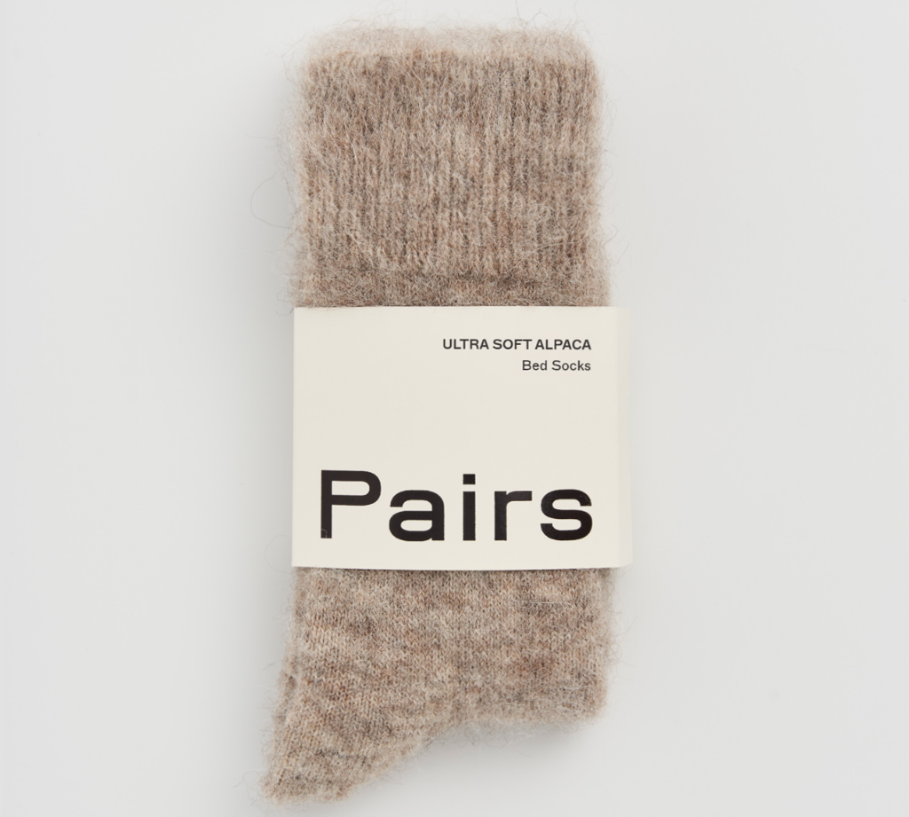 Pair of brown socks with a 'Pairs' label on a white background