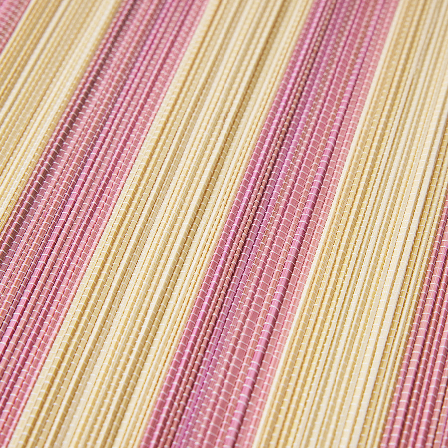 Close-up of pink and beige striped placemat by HKLIVING 