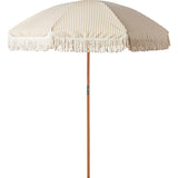 Beige striped beach umbrella with tassels on a white background