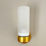 brass wall light with white glass shade