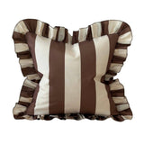 Striped pillow with ruffled edges on a white background