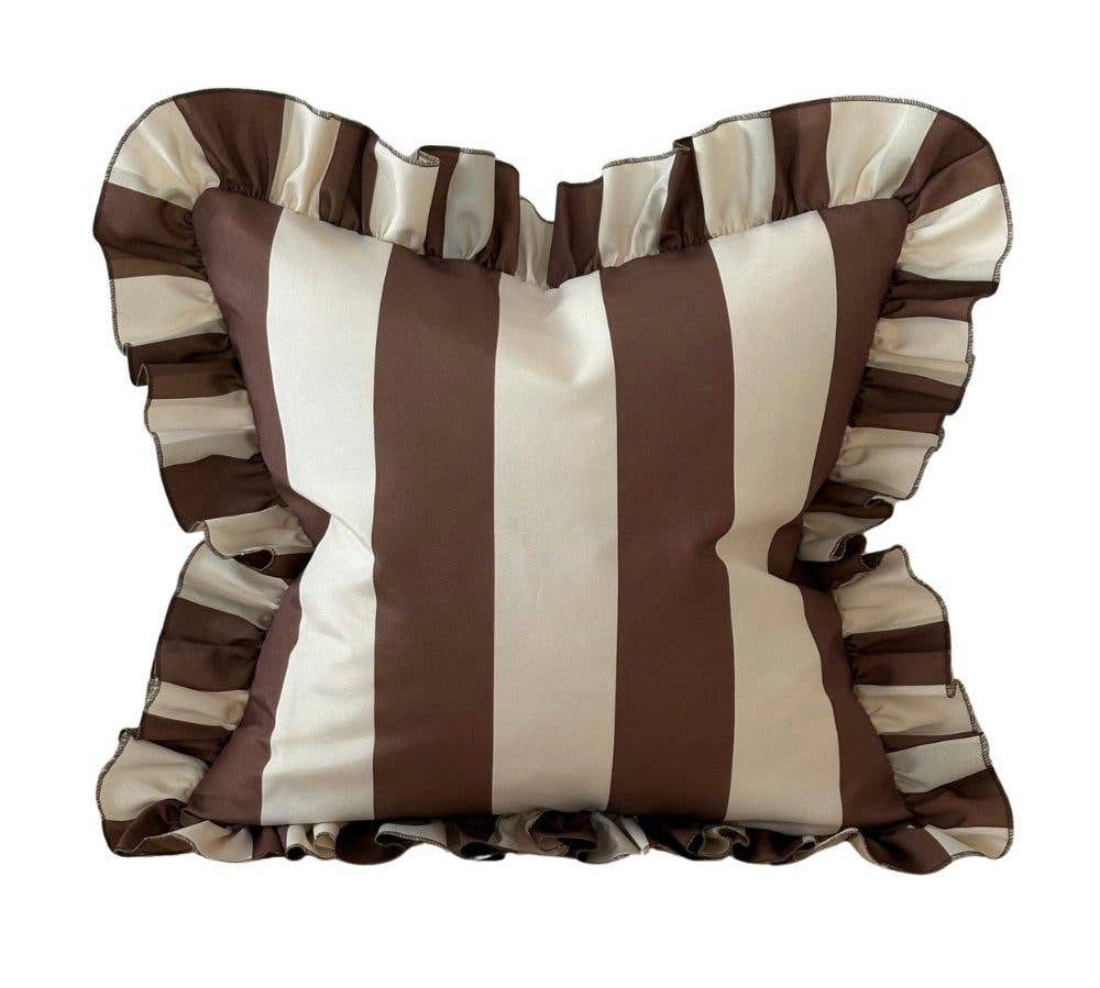 Striped pillow with ruffled edges on a white background