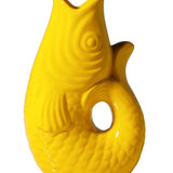Yellow ceramic fish-shaped vase on a white background
