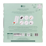 Back of a Christmas cracker packaging with text and graphics on a light green background