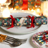 Decorative Christmas cracker on a plate with festive background