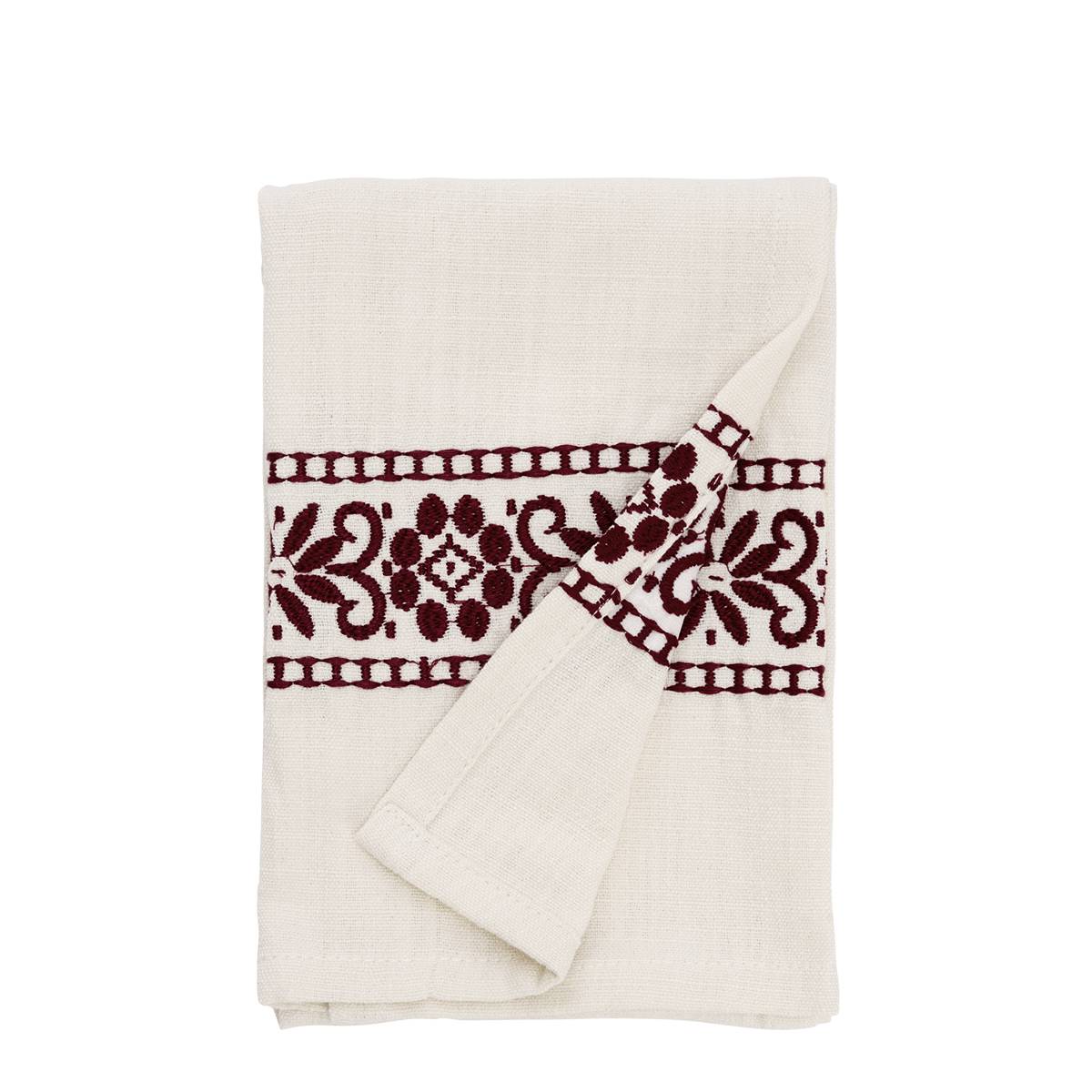 An off-white cotton muslin tea towel with a dark burgundy embroidered floral pattern, folded neatly on a solid white background.