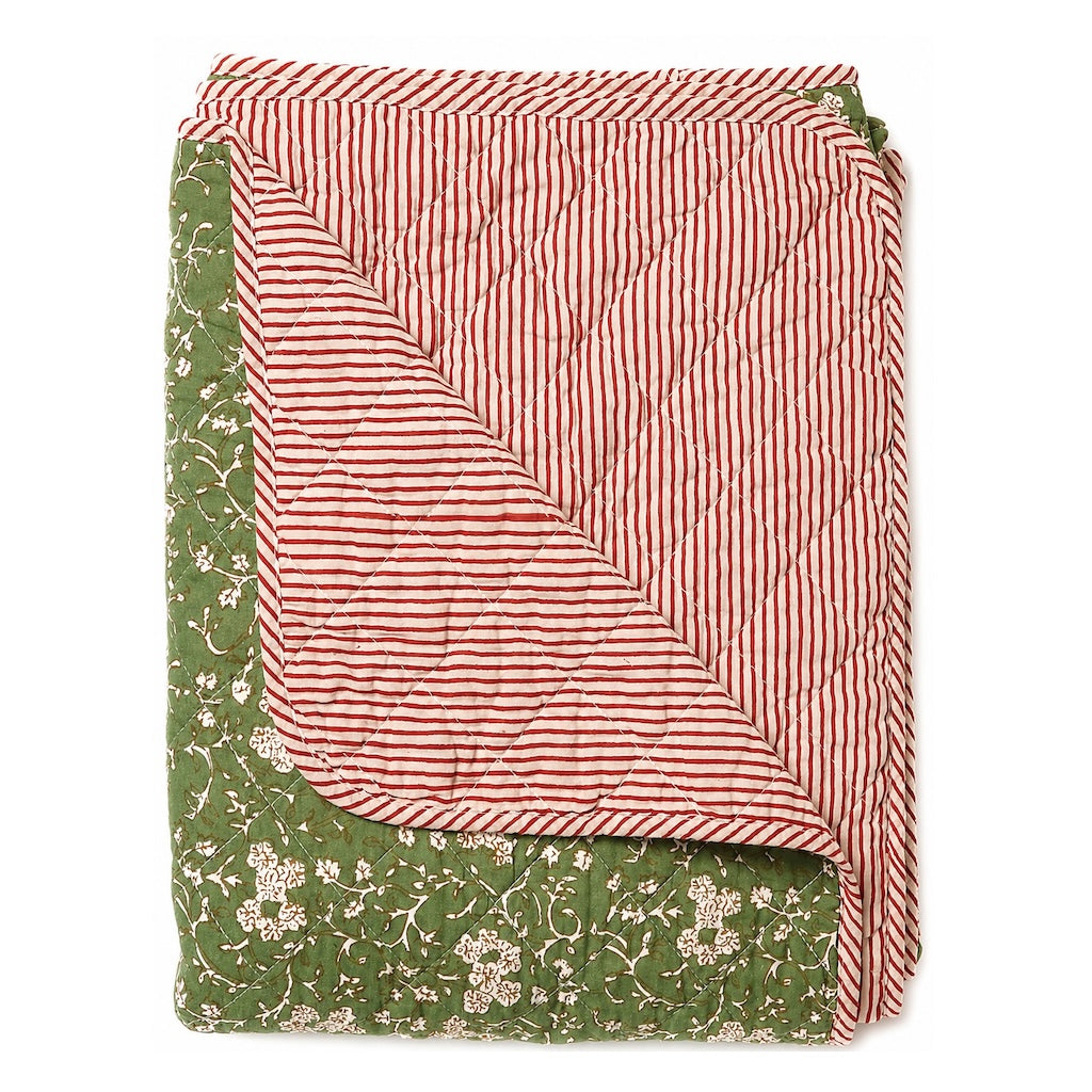 floral green throw with red and white stripe reverse