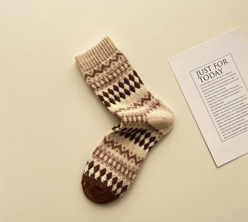 Knitted sock with a pattern on a beige background