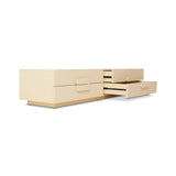 Beige dresser with open drawer on a white background