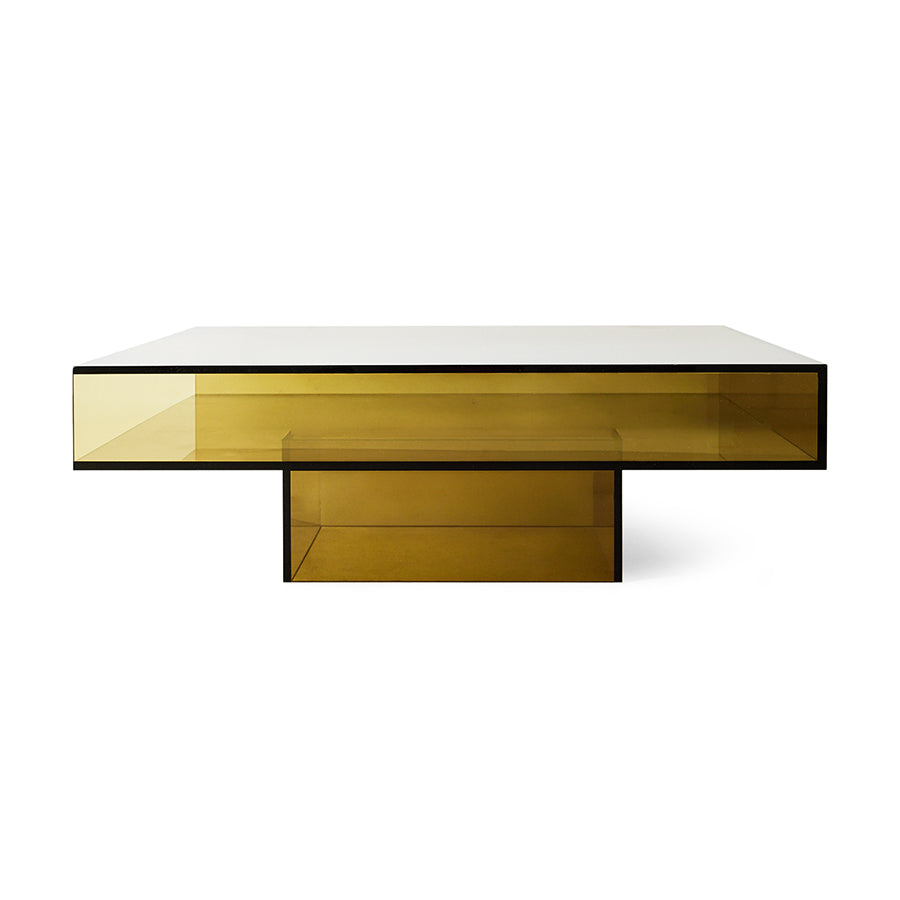 A modern rectangular coffee table with a translucent amber-yellow smoked glass top and base, supported by a black metal frame, shown on a solid white background.