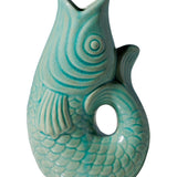 Turquoise ceramic fish-shaped vase on a white background