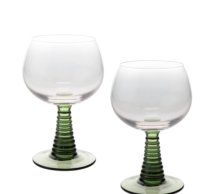 Two clear stemmed wine glasses with ribbed green stems and circular green bases, photographed on a clean white background.