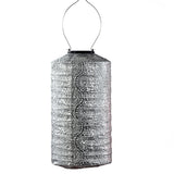 Decorative silver lantern with a white background
