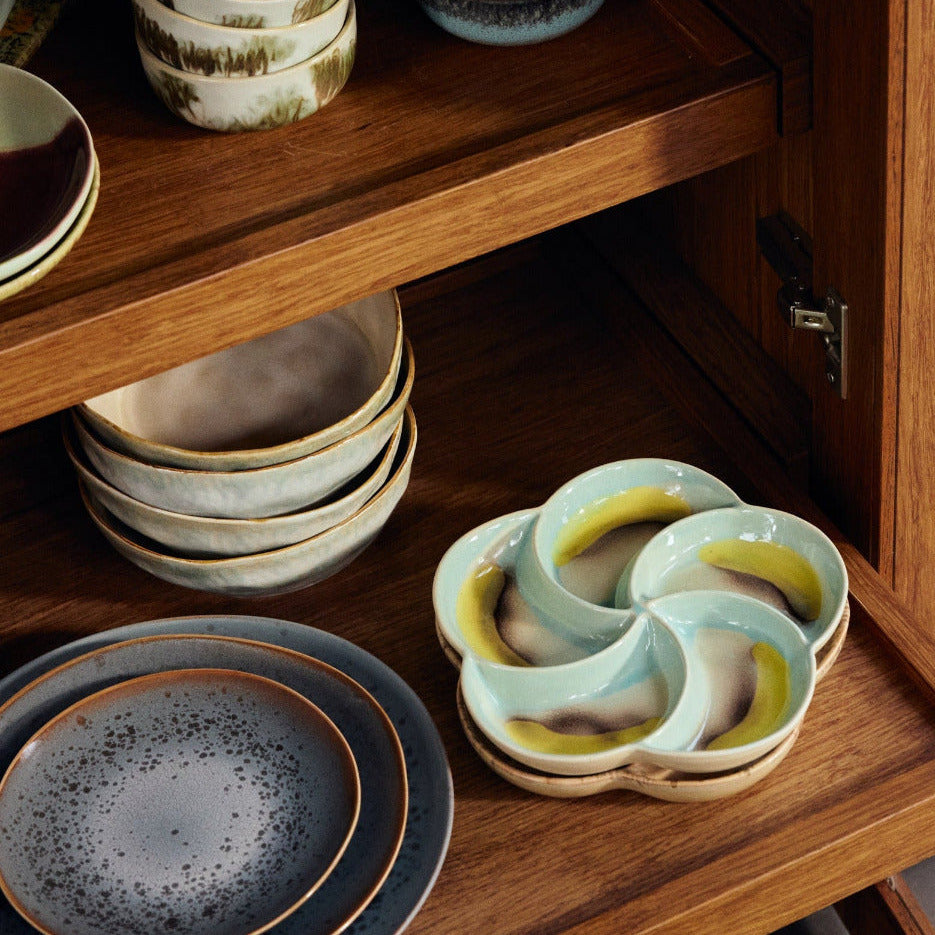 Wooden cabinet with ceramic dishes inside
