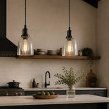 Modern kitchen with pendant lights, countertop, and shelves.