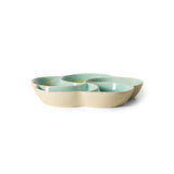 ceramic snack bowl in pastel green and beige on a white background