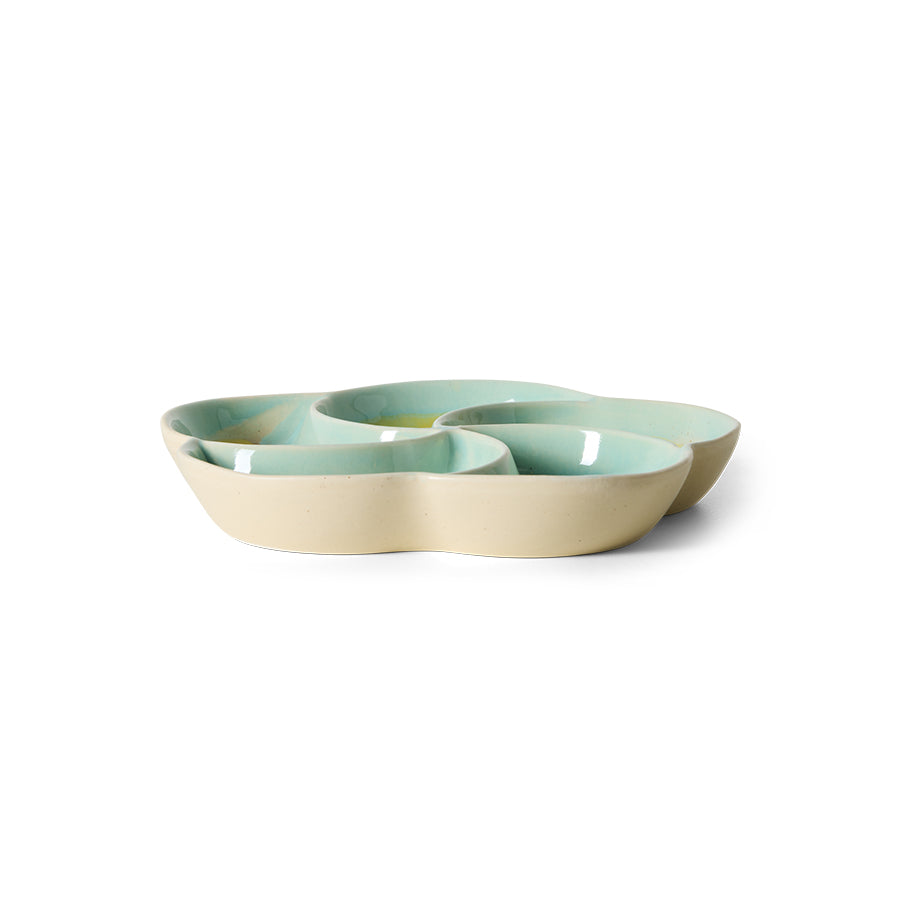 ceramic snack bowl in pastel green and beige on a white background