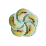 Ceramic snack plate with green and yellow design on a white background
