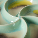 Close-up of a ceramic dish with blue and yellow design