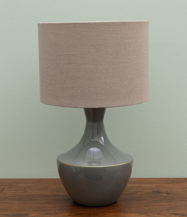 green ceramic table lamp with beige shade