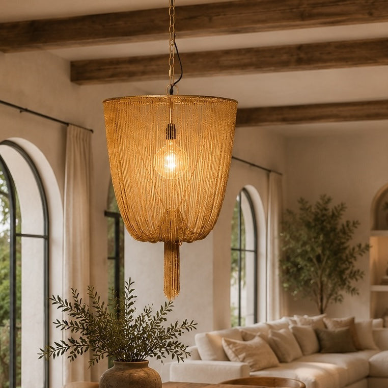 Cozy living room with wooden table, chairs, and a hanging lamp.