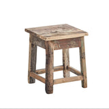 A rustic square wooden stool made from reclaimed wood, featuring a weathered brown and beige seat with a distressed finish and natural wood legs, isolated on a white background.