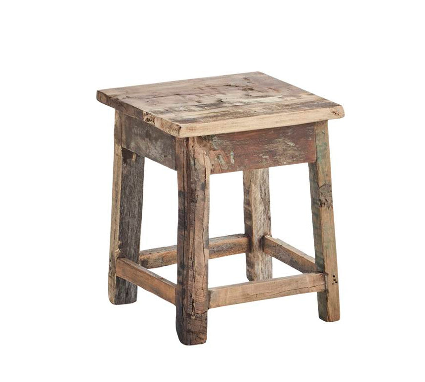 A rustic square wooden stool made from reclaimed wood, featuring a weathered brown and beige seat with a distressed finish and natural wood legs, isolated on a white background.