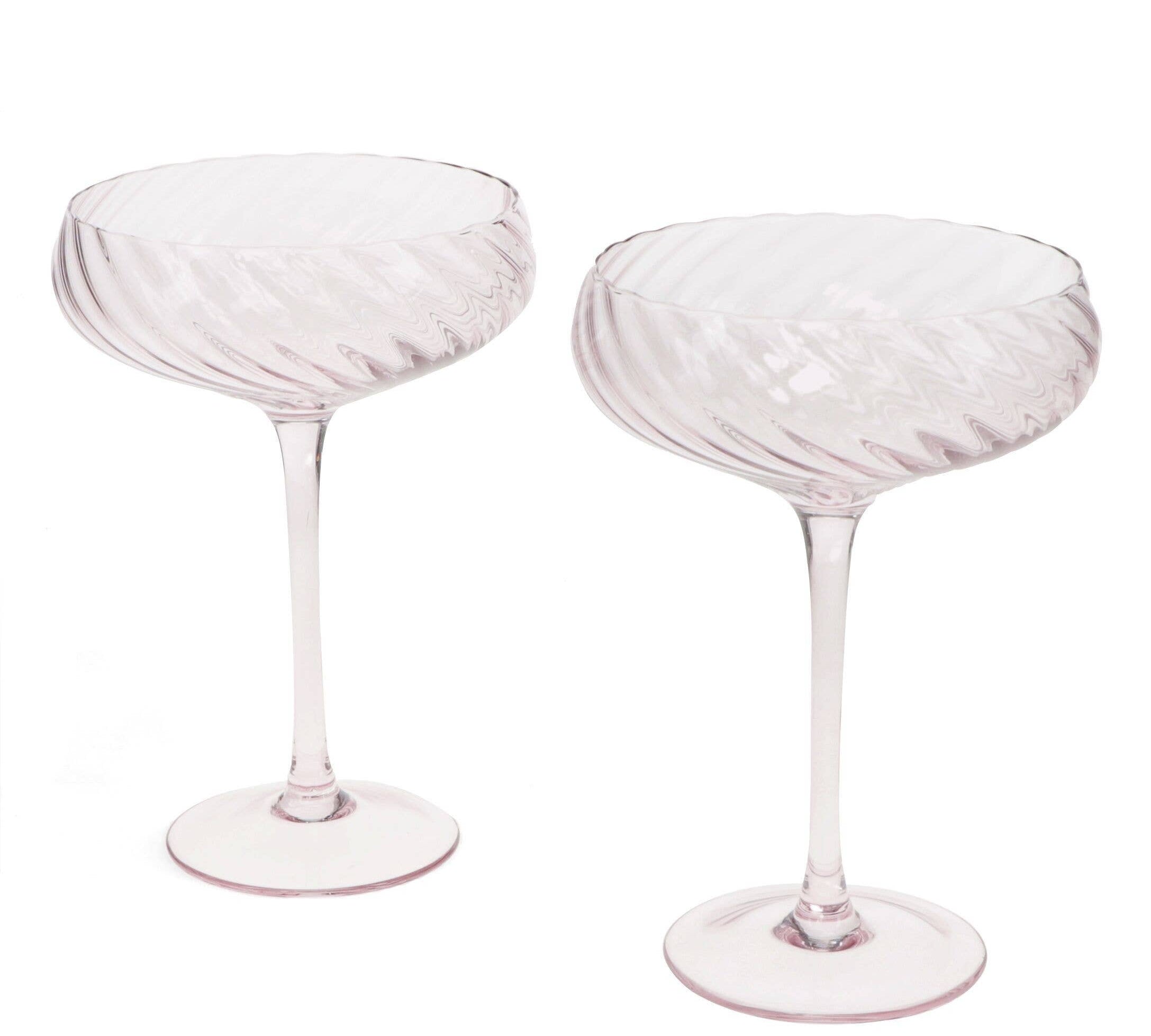 Two pink glasses goblets on a white background