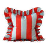 Striped pillow with ruffled edges in red and white on a white background