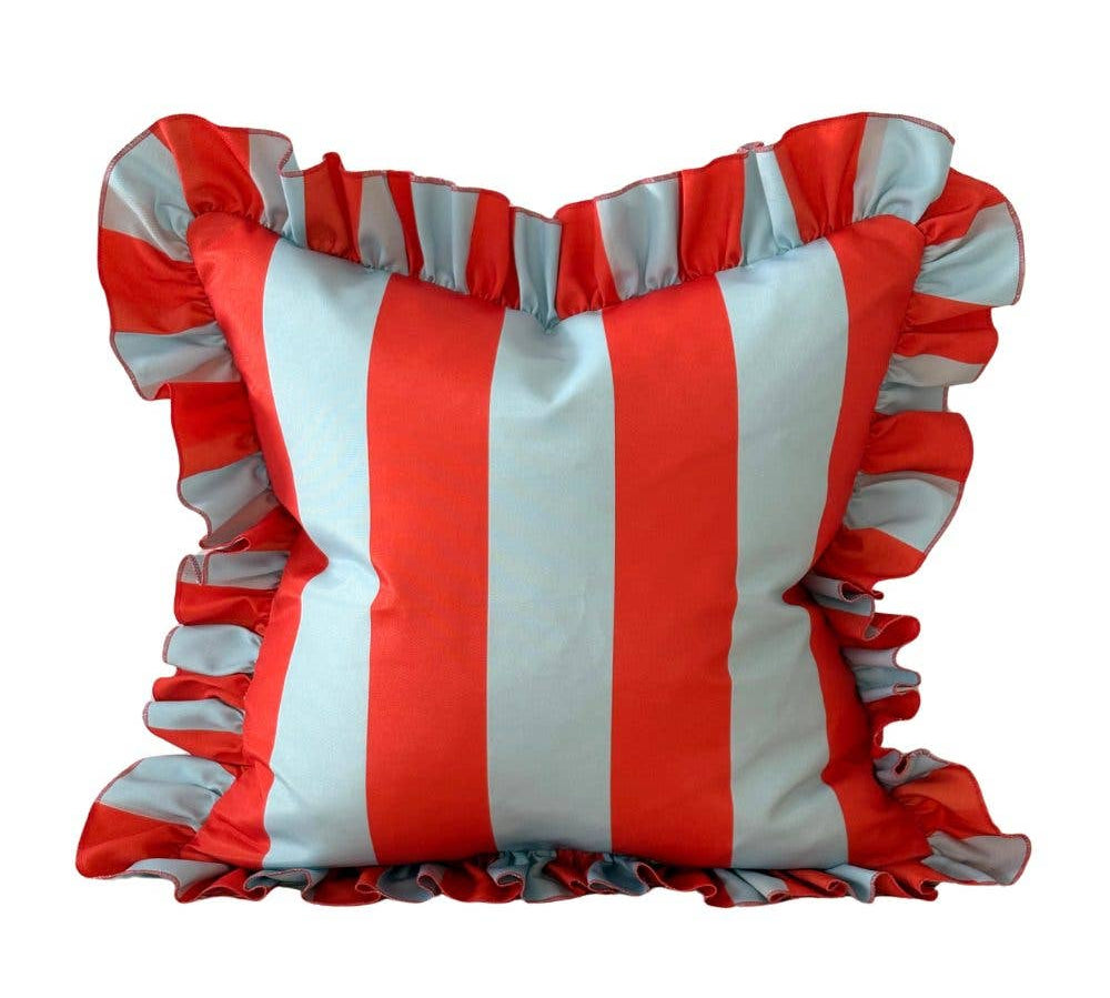 Striped pillow with ruffled edges in red and white on a white background