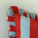 Red and light blue striped fabric on a white background