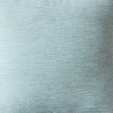 Close-up of a textured light blue fabric surface